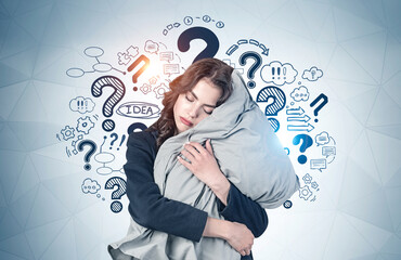 Sleeping young businesswoman, question marks