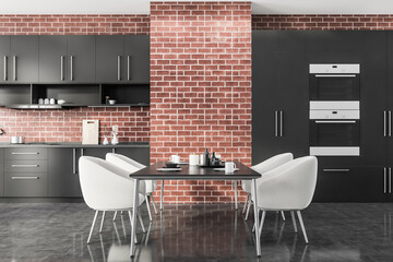 Brick kitchen with table and white armchairs