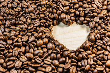 Roasted coffee beans with heart form
