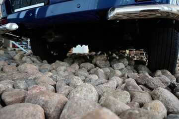 Photo of an automobile body part. Road close-up