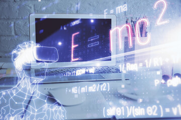 Desktop computer background and formula hologram writing. Double exposure. Education concept.