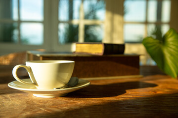 A white coffee mug on a wooden office desk