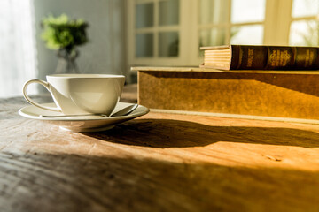 A white coffee mug on a wooden office desk