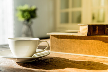 A white coffee mug on a wooden office desk