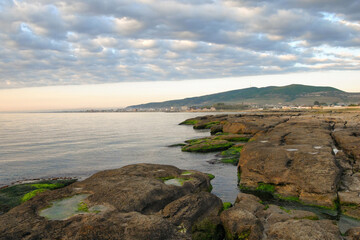 Fototapeta na wymiar Sunrise seascape. View at Caspian Sea and Derbent town. Dagestan, North Caucasus, Russia.