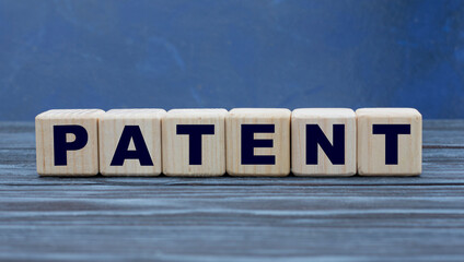 concept word PATENT on cubes on a blue background
