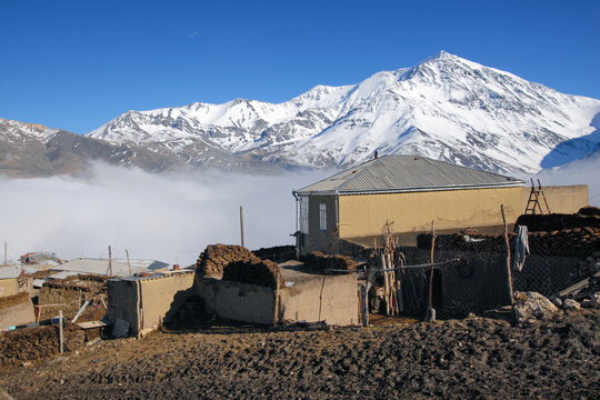 Kurush village (the southernmost point of Russia and the highest mountain settlement in Europe, 2560 m) and Mount Bazarduzu (4,467 m, the highest peak in Azerbaijan). Dagestan, North Caucasus, Russia.