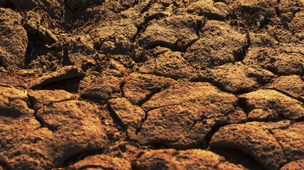 drought background texture of cracked earth soil orange color