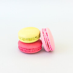 Colorful macarons on white background.