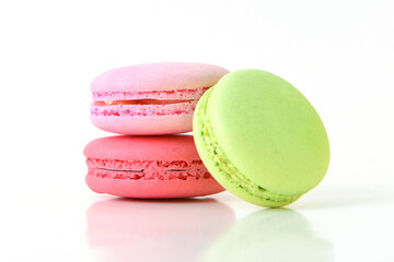 Colorful macarons on white background.