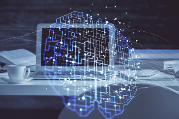 Double exposure of table with computer and brain hologram. Data innovation concept.