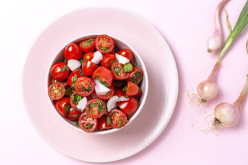 Homemade cherry tomato salad with fresh onions, mint, olive oil and salt