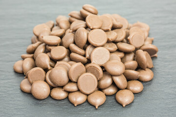 heap of sweet milk chocolate drops