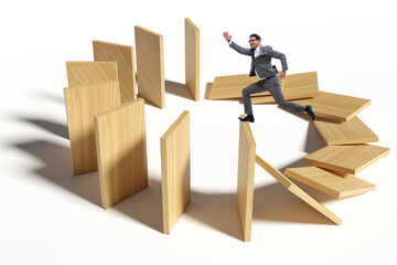 Businessman in domino effect concept