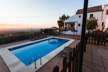 Exterior terrace of a rural rental house with pool in Spain.