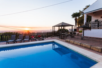 Exterior terrace of a rural rental house with pool in Spain.
