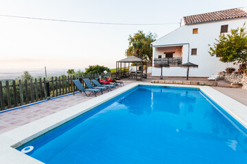 Exterior terrace of a rural rental house with pool in Spain.
