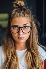Portrait of funny hipster woman with heterochromia