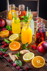 Assortment of juices and lemonades with fruits and herbs