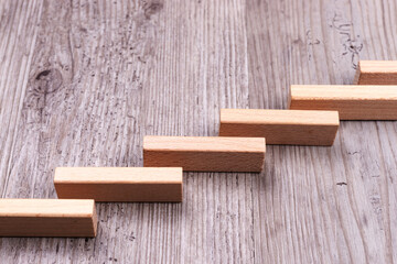 Step by step. Wooden stairs symbolize growth. Career development