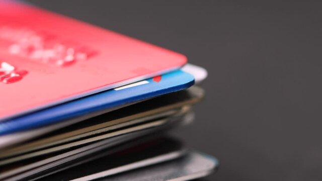 Colorful stack of credit cards close up.
