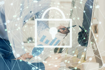 Multi exposure of lock icon with man working on computer on background. Concept of network protection.