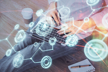 Media network theme hologram with man working on computer on background. Concept of internet communication. Double exposure.