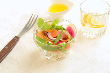 Citrus salad with radishes, carrots and arugula.