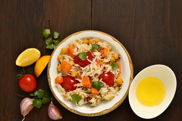 Rice with pumpkin, chickpeas and cherry, top view, copy space