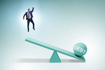 Obraz premium Debt and loan concept with businessman and seesaw