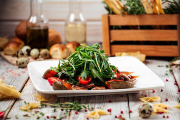 Salad baked pumpkin spinach and beef tenderloin