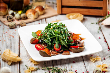 Salad baked pumpkin spinach and beef tenderloin