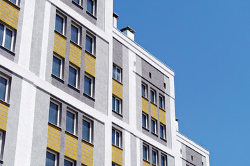 Modern, new executive apartment building on background sky