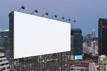 Obraz premium Blank white road billboard with Bangkok cityscape background at sunset. Street advertising poster, mock up, 3D rendering. Side view. The concept of marketing communication to promote or sell idea.