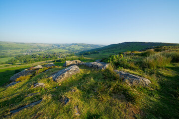 Along Baslow Edge to Curbar Edge and beyond on a bright, hazy summer morning.