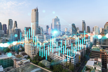 Obraz premium Day time bright Bangkok city background with business chart grid. Success and finance concept. Doublexposure
