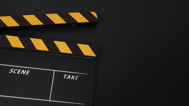 Clapper board or movie slate. it use in video production or cinema industry on black background.