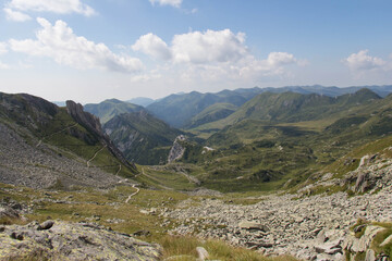 The view of mountains with clouds on backgrund, Italian Alps.