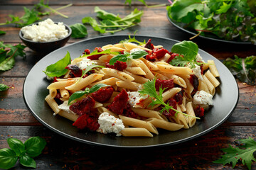 Chorizo, Penne pasta with creamy ricotta cheese and greens