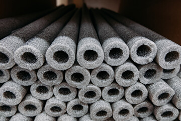 Stacked insulation for pipes of polyethylene foam in warehouse