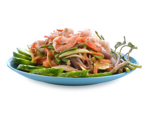 Papaya salad in a plate on a table.