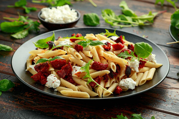 Chorizo, Penne pasta with creamy ricotta cheese and greens