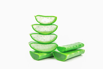 Slices of fresh aloe vera plant stacked with water dropping isolated on white background.