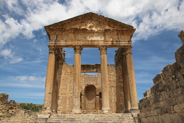 Fototapeta na wymiar The remains and ruins of the Roman city of Dougga with the Capitol in Tunisia. 