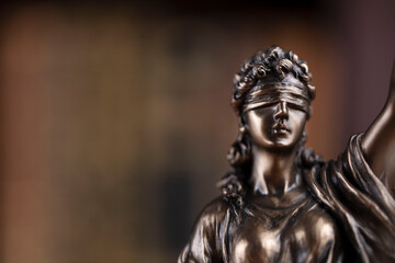 Justice concept. Themis statue in jugde office.