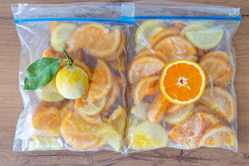 frozen lemon, orange, strawberry, kiwi in the refrigerator bag. fresh appetizing juice. frozen...