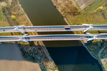 New modern double cable-stayed three-lane bridge over Vistula River in Krakow, Poland. Aerial view from above. Part of the ring road around Krakow