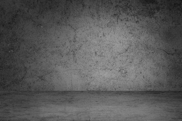 Empty space of Studio dark room black concrete grunge wall with concrete floor.