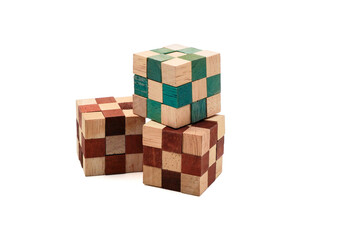 wooden puzzle cube toy on white background