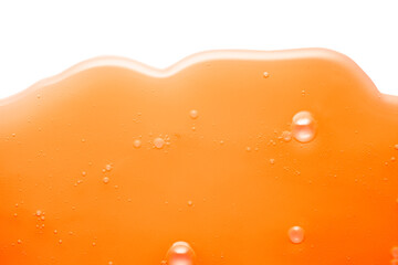 Orange vitamin c foam or serum texture background isolated on white